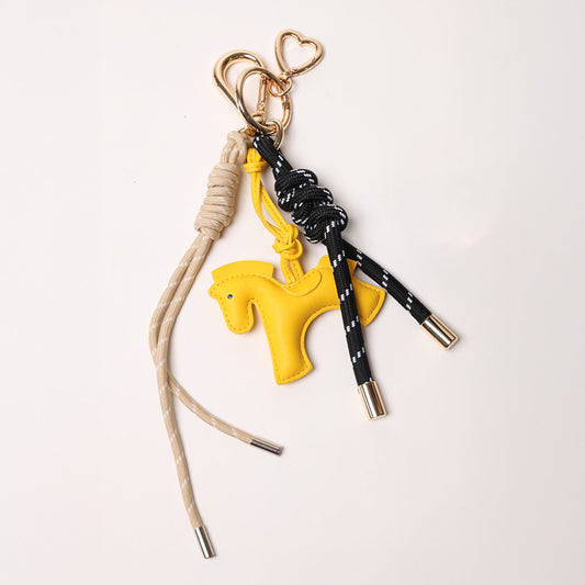 KEY CHAIN BLACK WITH CHARMS - TAN ROPE AND YELLOW HORSE