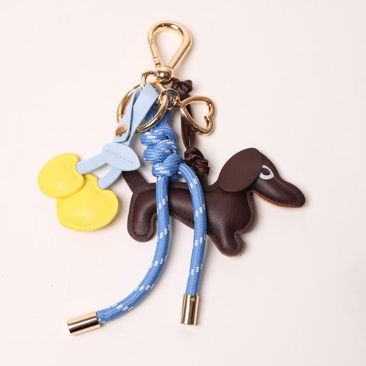 KEY CHAIN BLUE WITH CHARMS - ESPRESSO DOG AND YELLOW HEART CHERRIES