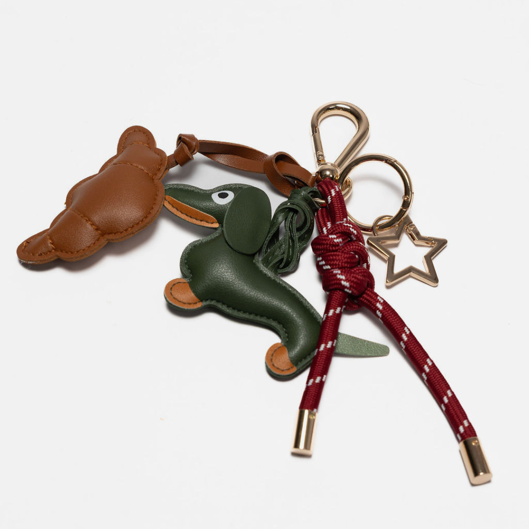 KEY CHAIN BURGUNDY WITH CHARMS - SAFARI DOG AND BROWN CROISSANT