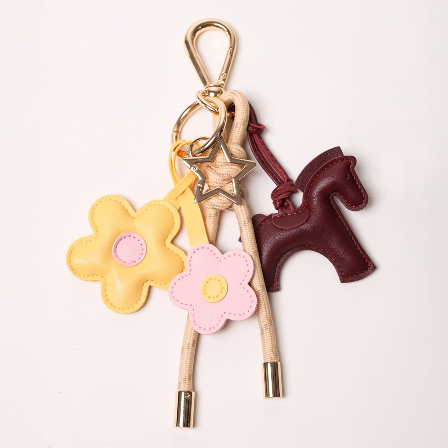 KEY CHAIN TAN WITH CHARMS - BURGUNDY HORSE AND YELLOW/PINK DAISIES