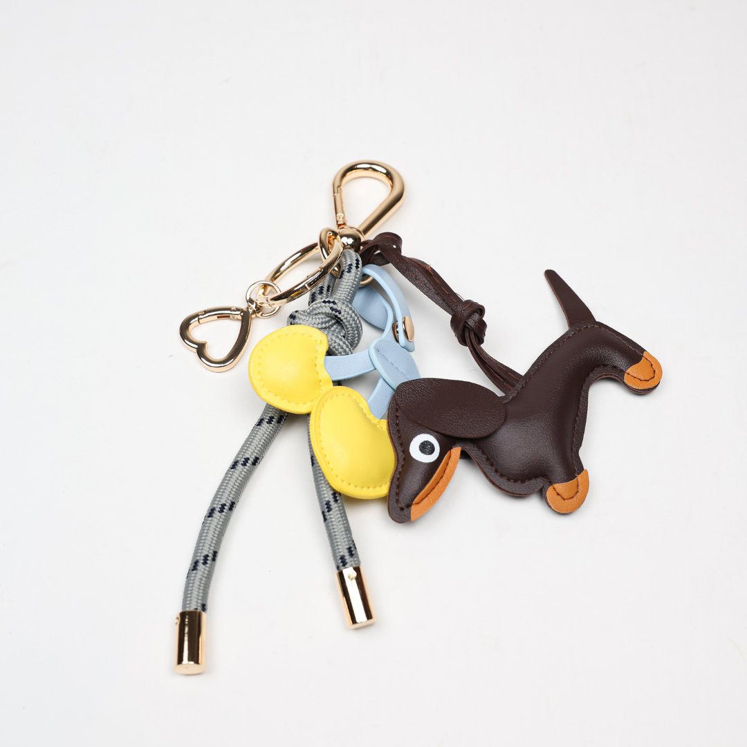 KEY CHAIN STONE GREY WITH CHARMS - ESPRESSO DOG AND YELLOW HEART CHERRIES