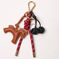 KEY CHAIN BURGUNDY WITH CHARMS - BROWN HORSE AND BLACK CHERRIES
