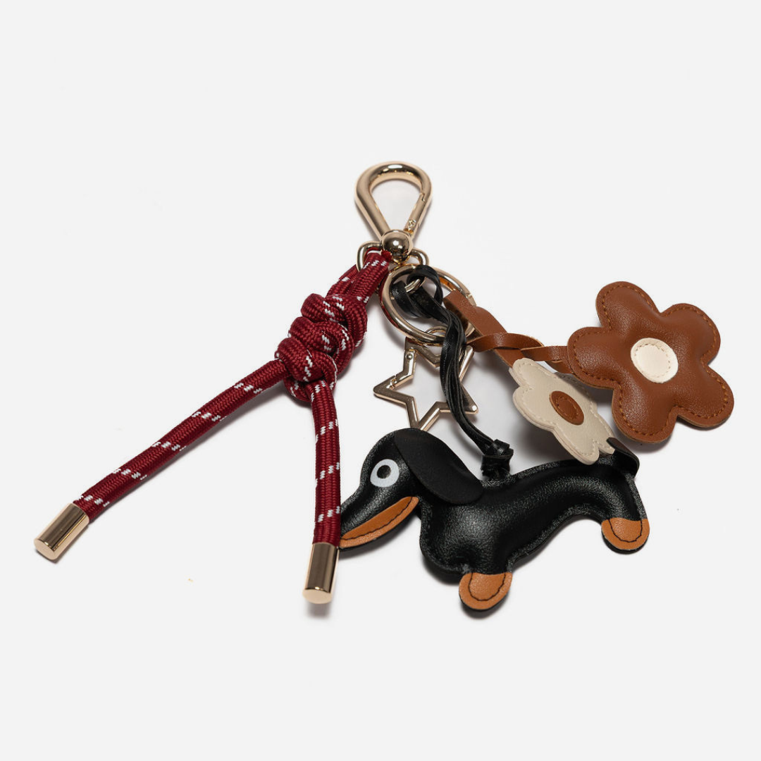 KEY CHAIN BURGUNDY WITH CHARMS - BLACK DOG AND BROWN DAISIES