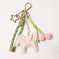 KEY CHAIN SAFARI GREEN WITH CHARMS - WHITE FLYING HORSE AND PINK CHERRIES