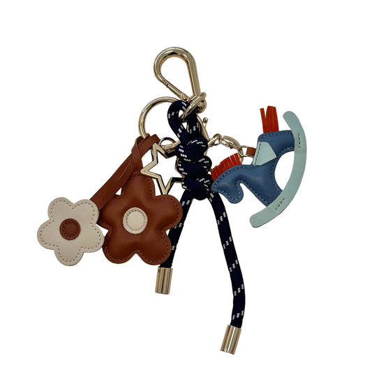 KEY CHAIN DEEP BLUE WITH CHARMS - BROWN DAISIES AND BLUE ROCKING HORSE