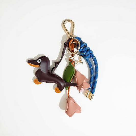 KEY CHAIN STORMY BLUE WITH CHARMS - BROWN DOG AND PINK ROSES