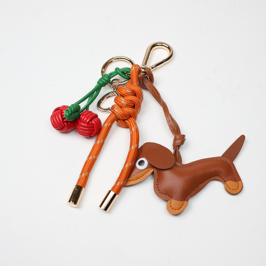 KEY CHAIN BURN ORANGE WITH CHARMS - BROWN DOG AND RED CHERRIES