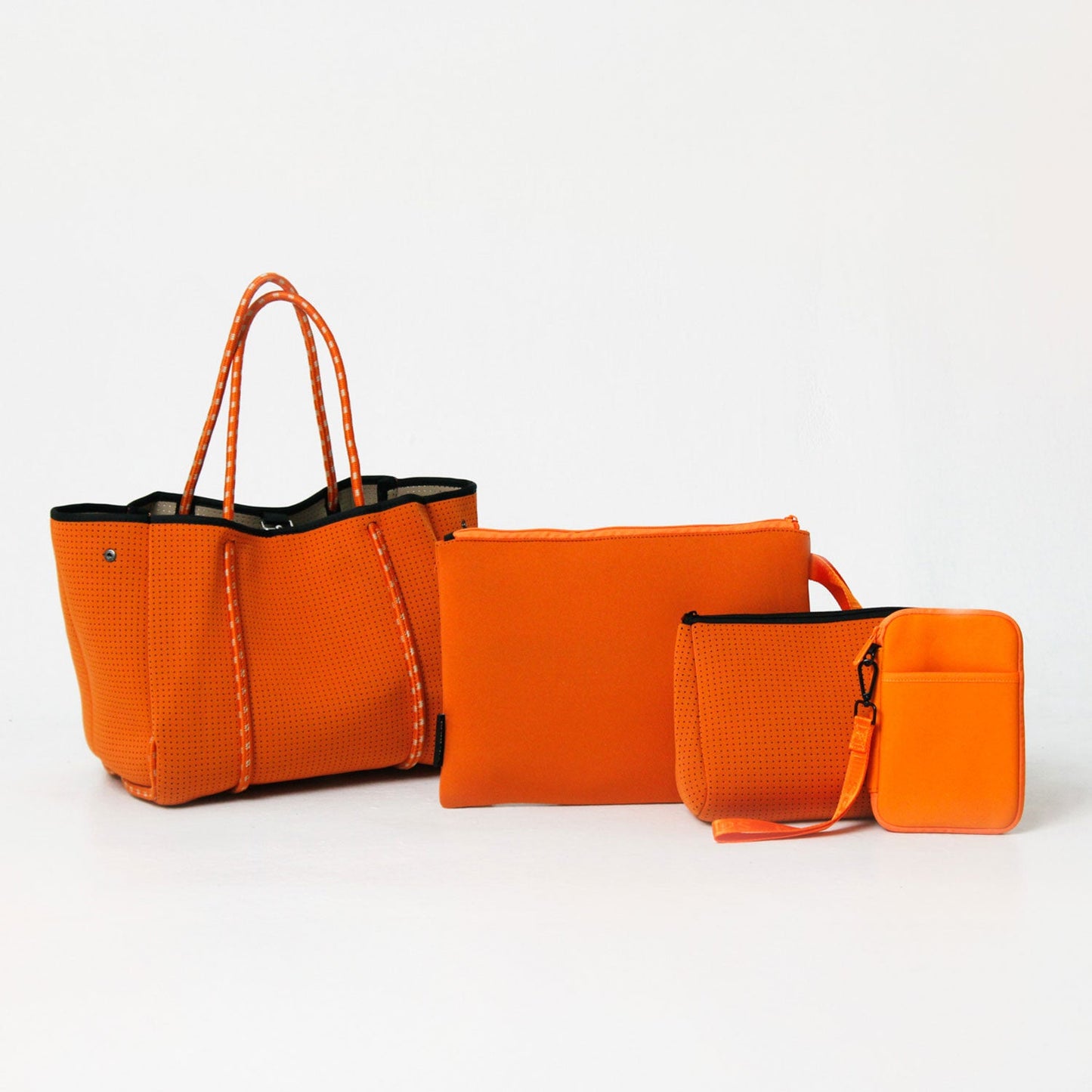 BURN ORANGE SET: EVERYDAY TOTE + OVERSIZED WRISTLET POUCH + ESSENTIAL POUCH + PASSPORT WALLET